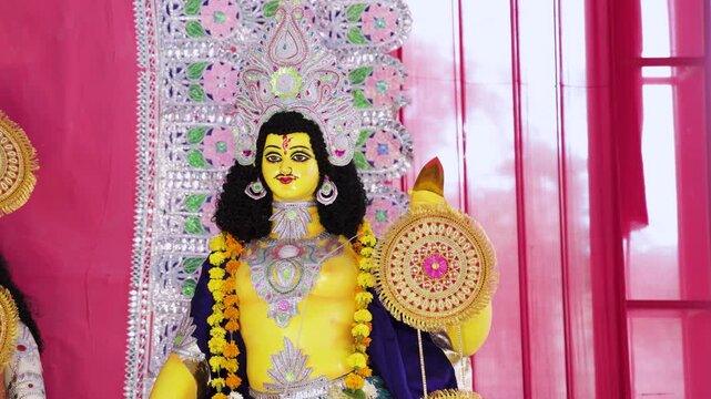 Hindu Deity Kartikeya Idol with Traditional Attire and Ornate Religious Decorations