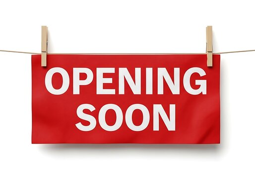 Opening soon sign on clothesline with clothespins