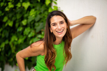 Fototapeta premium Joyful european woman laughing outdoors