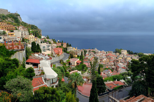 Scenic coastal village nestled on a hillside overlooking the deep blue sea