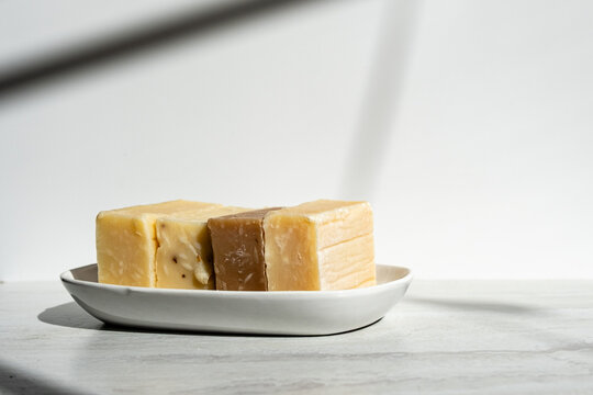 Handmade Artisan Soap Bars on White Ceramic Plate