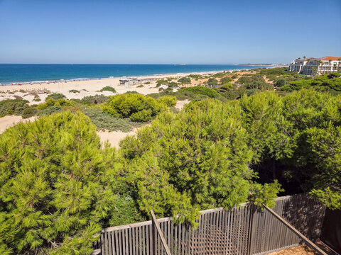Sand dunes in front of La Barrosa beach in Sancti Petri, Chiclana de la Frontera, Cadiz, Spain