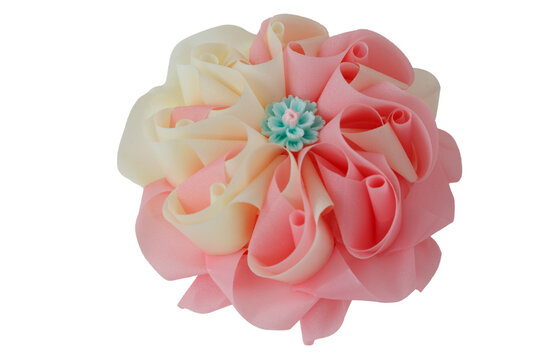 Handmade craft Thai festival decoration,Coins wrapped in floral ribbons on  a white background.