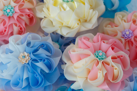 Handmade craft Thai festival decoration,Coins wrapped in floral ribbons on a basket against   background.