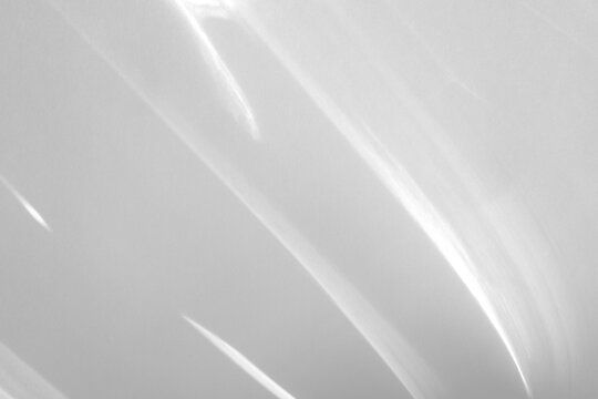 Diagonal light caustics and soft shadows appear on a transparent png background. It adds a realistic water reflection effect to product mockups or minimalist interior scenes.