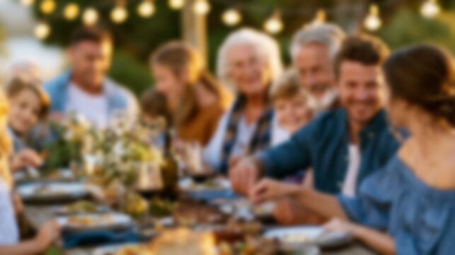 Multi generational family gathering outdoors, enjoying a meal and celebrating togetherness