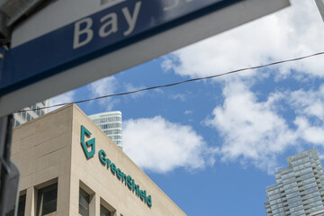 Obraz premium street sign and exterior of Commerce Court South (30 Wellington St W) with sign of GreenShield, a health benefits company, Toronto