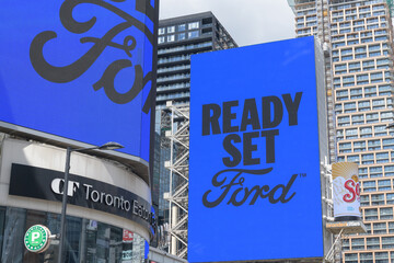 Obraz premium digital sign featuring ad for Ford Motor Company (Canada) at Sankofa Square, Toronto