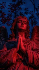 Naklejka premium Ethereal angel statue in red light, serene and mystical mobile wallpaper.