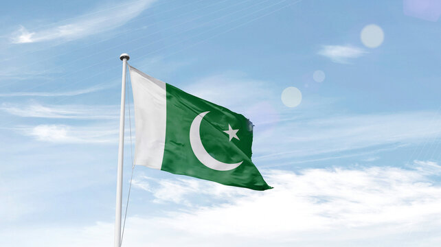 Pakistan national flag waving in sky.