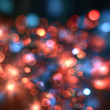 Blurry glowing orbs of light in warm and cool tones shimmer