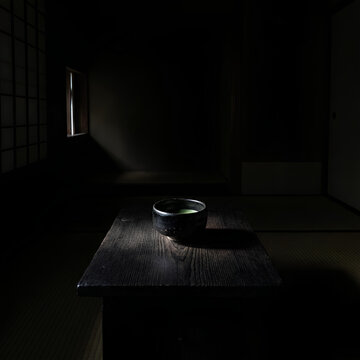 Japanese Matcha Tea Ceremony Bowl on Table in Dark Room