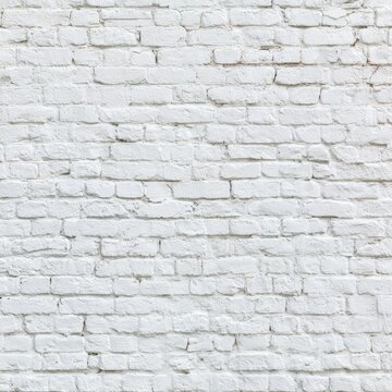 A textured, aged white brick wall with visible mortar lines