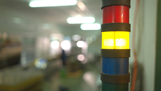Status indicator lights used for monitoring and controlling processes in large-scale bottled beverage production lines
