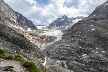 Obraz premium Glacier and rocky mountain landscape with waterfall, Austria, Tyrol, Mittelberg (Pitztal), 29 June 2026