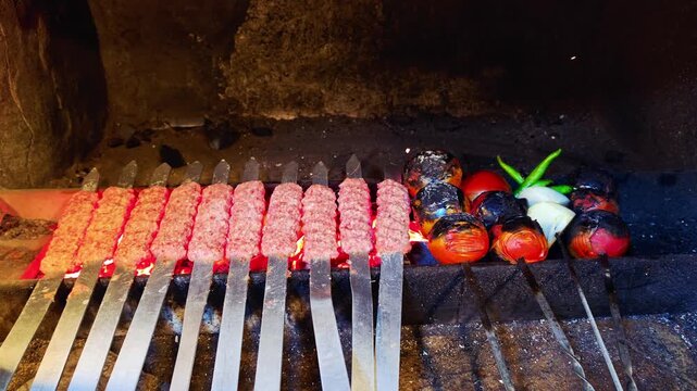 Basra, Iraq - August 31, 2026: Raw kebab skewers grilling over traditional charcoal brick oven
