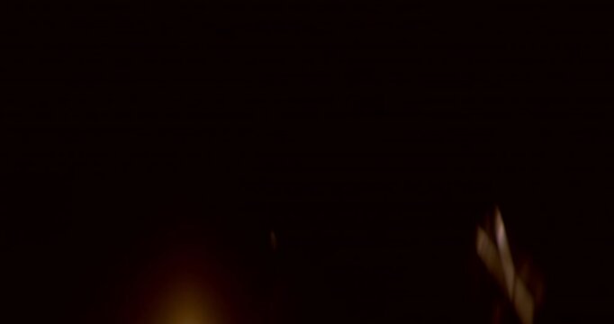 Anamorphic wide lens flare burst in slow motion, isolated on black background. Cinematic light streaks, ideal for VFX compositing, overlays, sci-fi transitions and film effects.