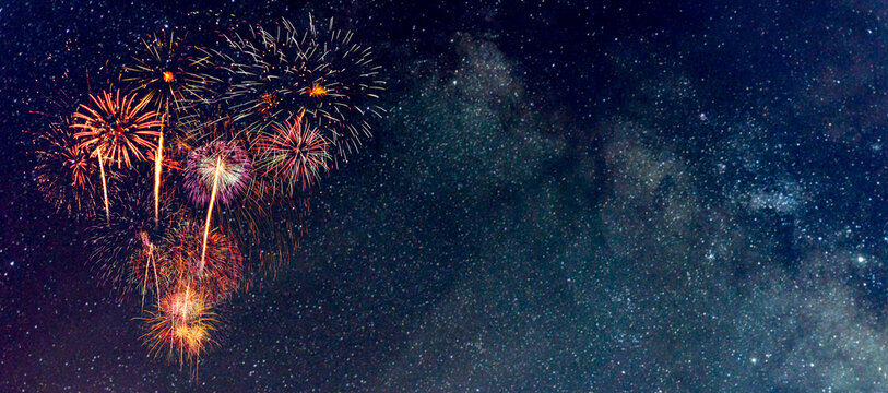 Fireworks with blur milky way background for fun in festiva