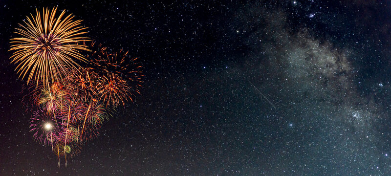 Fireworks with blur milky way background for fun in festiva