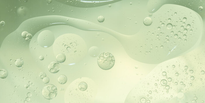 Abstract Green water bubbles essential oil beauty collagen Serum Repair cell background.
