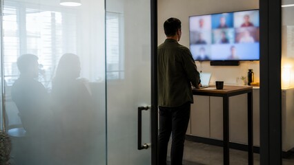 Fototapeta premium Small office hybrid team check in through frosted glass