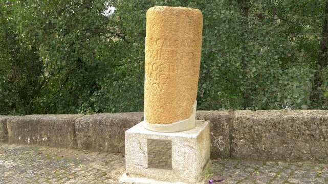 Close view of the Roman milestone beside Ponte da Cigarrosa in Pet&iacute;n, a historic marker from the ancient Via Nova route through Valdeorras in the province of Ourense, Galicia, northwestern Spain