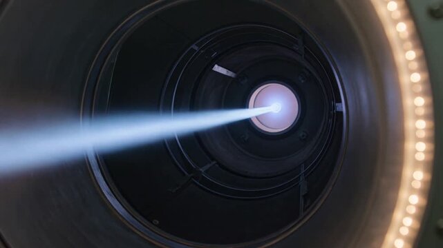 Powering plasma thruster probe sending focused blue plume into lab chamber, LED rim, for testing