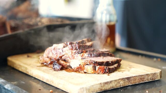 Chef serving smoked Argentine beef steak on wooden cutting board with smoke &mdash; 4K