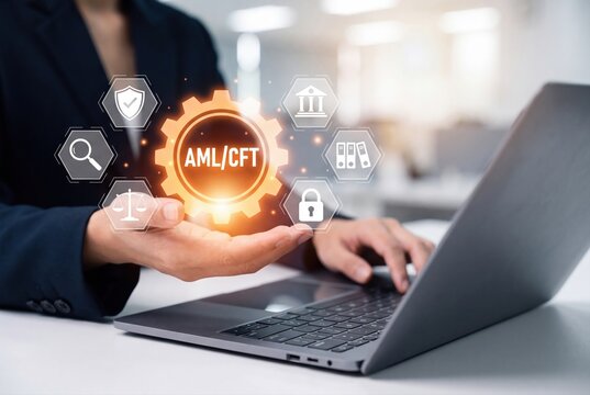Business professional using AML CFT compliance software on a laptop with digital interface