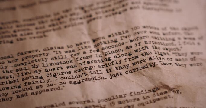 Staged close-up pan revealing an aged typewritten document presented as a declassified UFO report from a government archive.