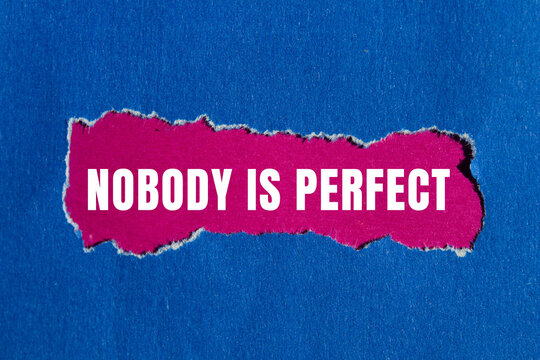 Nobody is Perfect message written on ripped torn paper background. Conceptual Nobody is Perfect symbol. Copy space.