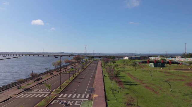 Aerial view along the quiet waterfront avenue of Posadas beside the Paran&aacute; River and international bridge.