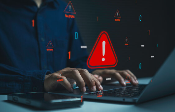 Cybersecurity warning alert with person using laptop to detect digital threats, protect sensitive data prevent cyber attacks manage security risks and strengthen online information protection.