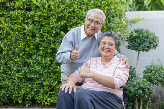 Two older adults enjoy time together outdoors.