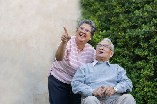 Two older adults enjoy time together outdoors.