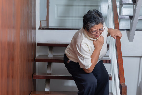 Elderly woman grab his chest with hand suffer from chest pain