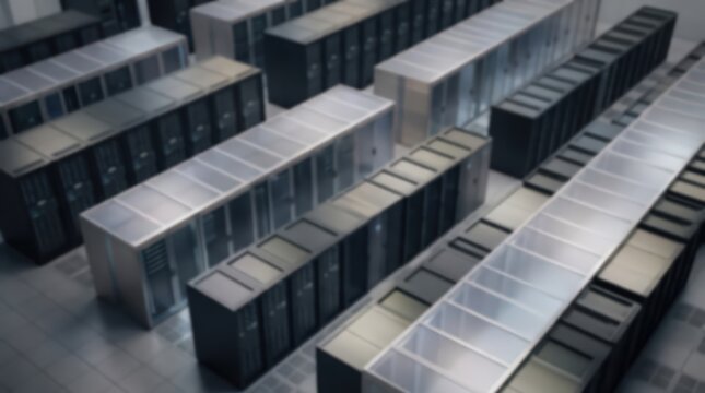 Server racks arranged in rows within a large data center facility. High-tech infrastructure equipment stands in a clean industrial environment with a soft focus perspective.