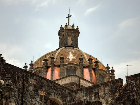 Church Dome with Cross under Cloudy Sky