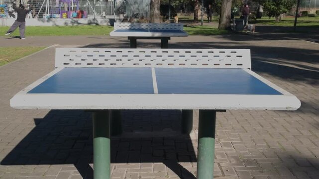 Outdoor concrete ping pong table in public park