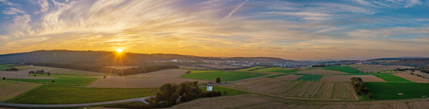 A replica of a Limes tower near Idstein in the Taunus region, seen from a bird's-eye view at sunset.