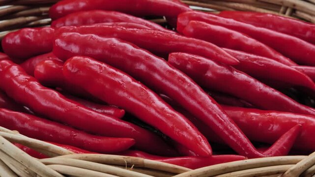 fresh red chili peppers in a basket	