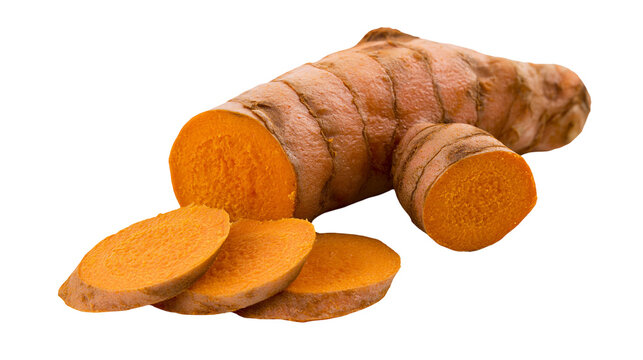 Fresh raw turmeric root with sliced pieces showing vibrant orange interior