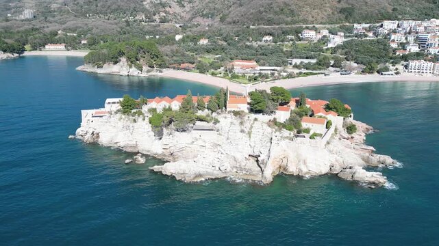 The drone flies around the beautiful island of Sveti Stefan. Montenegro