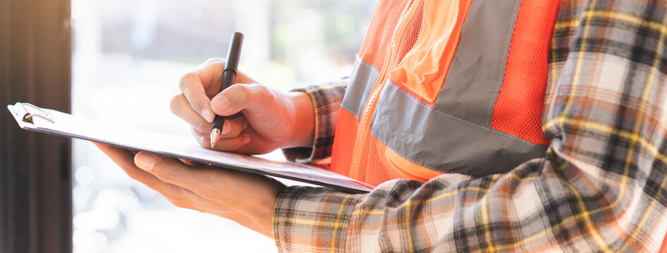 Building inspection asian contractor young man, male inspecting home, reconstructed construction, renovation or check defect, before finish handing it over to client, customer. Engineering worker.