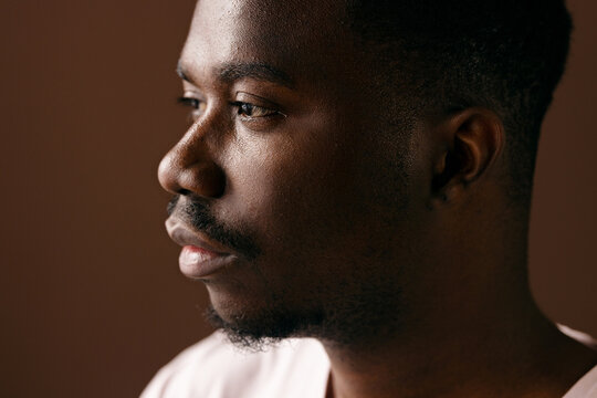 Thoughtful Portrait Of Young Man In Soft Light