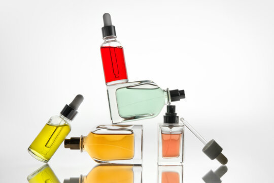 Dropper Bottles and Perfume Bottles in Abstract Laboratory Composition