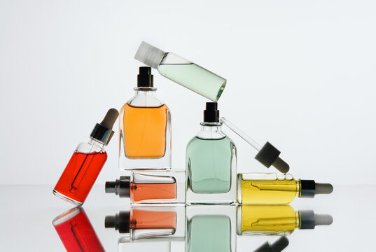 Dropper Bottles and Perfume Bottles in Abstract Laboratory Composition