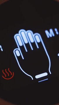 electric massager display showing modes and massaged areas