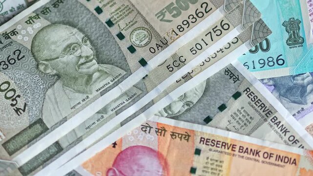 Panoramic close-up view of Indian rupee (INR) banknotes of different denomination. Indian cash money.
