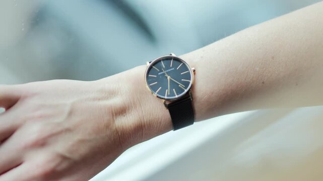 Close view of elegant watch on female wrist with refined minimalist style